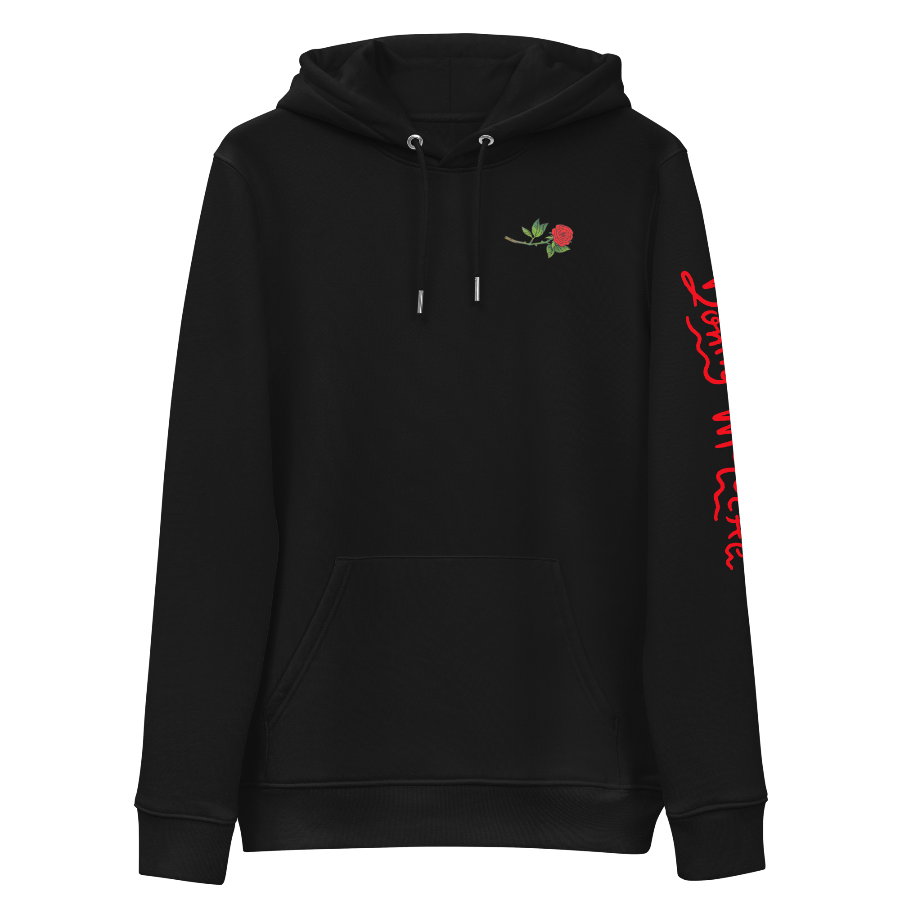The front of a black hoodie with a small illustration of a tilted red rose; placed over the heart on the left side of the chest. © Donny Meloche, 2023.