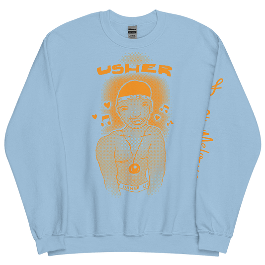 An image of a baby blue sweatshirt with an orange graphic featuring a childlike illustration of American R&B music singer, Usher Raymond. He stands smiling with a chain around his neck and musical notes around his head. © Donny Meloche, 2023.