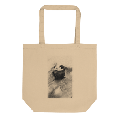 Tan tote bag featuring distressed ancient alien corpse graphic. © Donny Meloche.