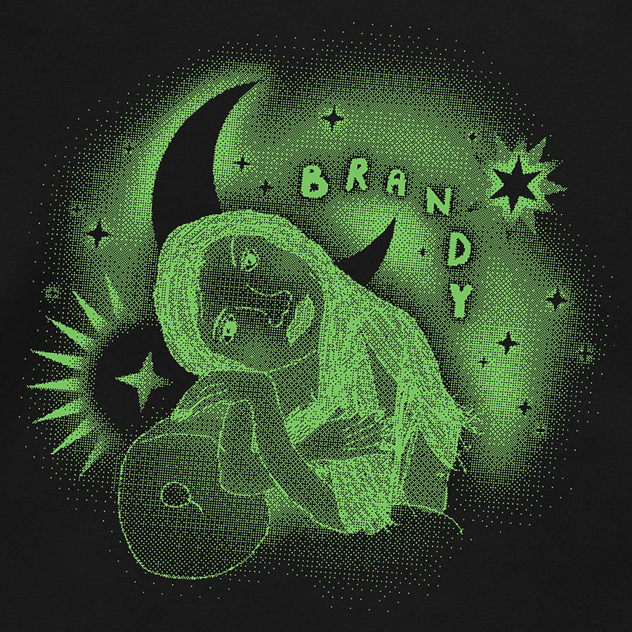 Detail of a black hoodie featuring a vintage 90s childhood fan art of American singer Brandy. In the artwork, Brandy is reclining on a couch, surrounded by graphic stars and a moon, with handwritten bubble letters spelling out 'BRANDY. © Donny Meloche, 2023.