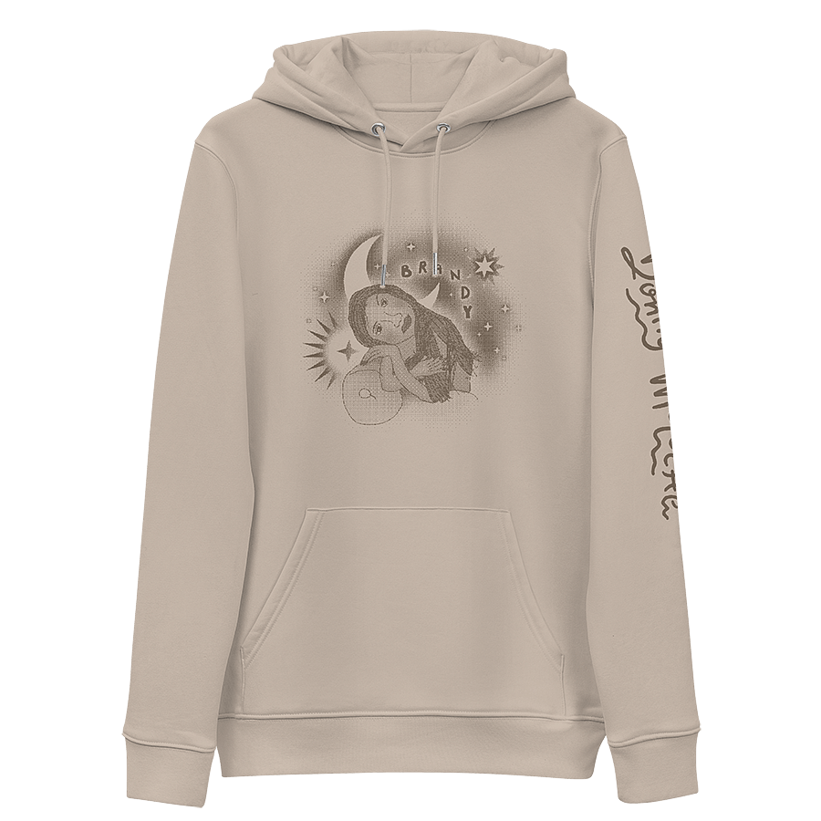 The front of a tan hoodie featuring a vintage 90s childhood fan art of American singer Brandy. In the artwork, Brandy is reclining on a couch, surrounded by graphic stars and a moon, with handwritten bubble letters spelling out 'BRANDY. © Donny Meloche, 2023.