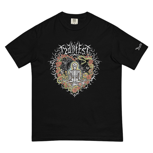 Front of black graphic tee with meditating skeleton surrounded by colorful flowers, insects, and 'Manifest' text. Includes expressive and third-eye imagery. © Donny Meloche, 2023.