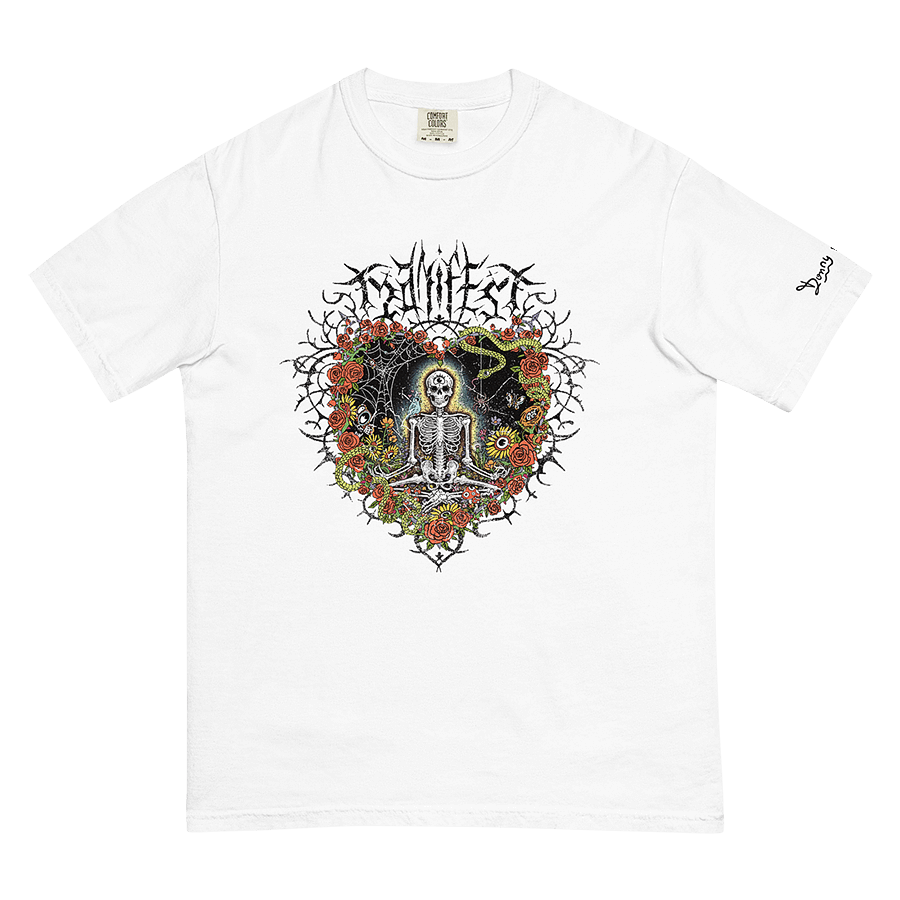 Front of white graphic tee with meditating skeleton surrounded by colorful flowers, insects, and 'Manifest' text. Includes expressive and third-eye imagery. © Donny Meloche, 2023.