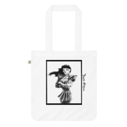 A white fashion tote bag with a grungy and distressed character mashup of Xena the Warrior Princess and Chyna wrestler tribute art by Donny Meloche. Unique and stylish design. © Donny Meloche, 2023.